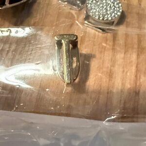 Gold letter “T” charm for keep collective